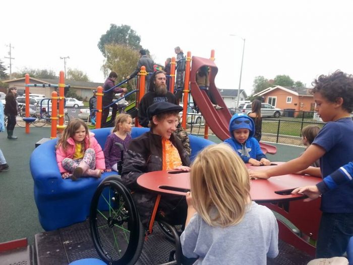 Inclusive playground equipment that fits wheelchair.