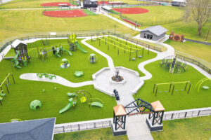 overview of entire playground that uses artificial turf
